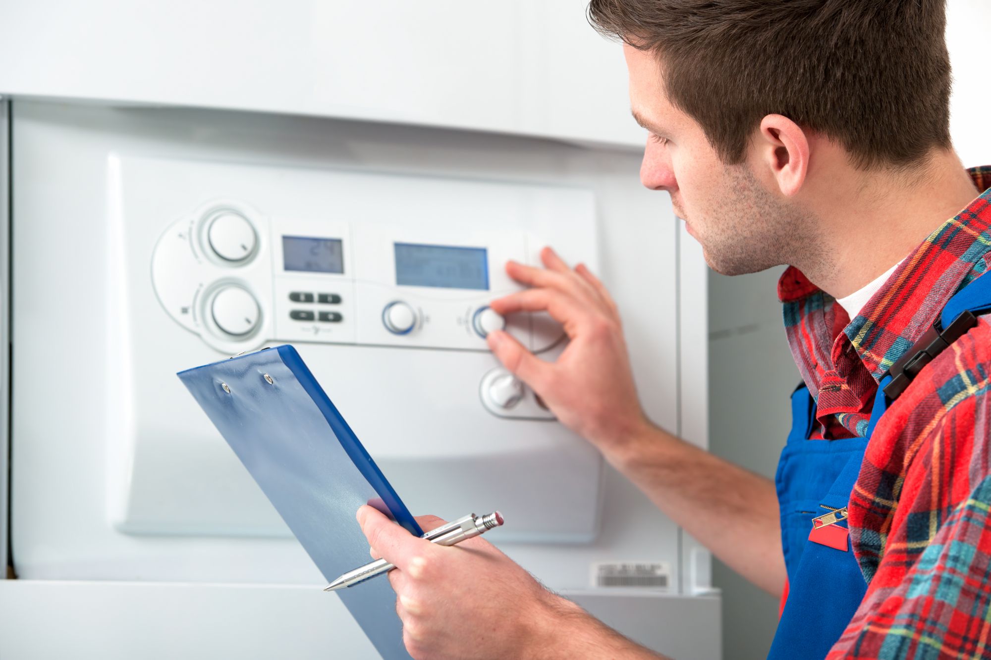 Technician making repairs to an HVAC system.